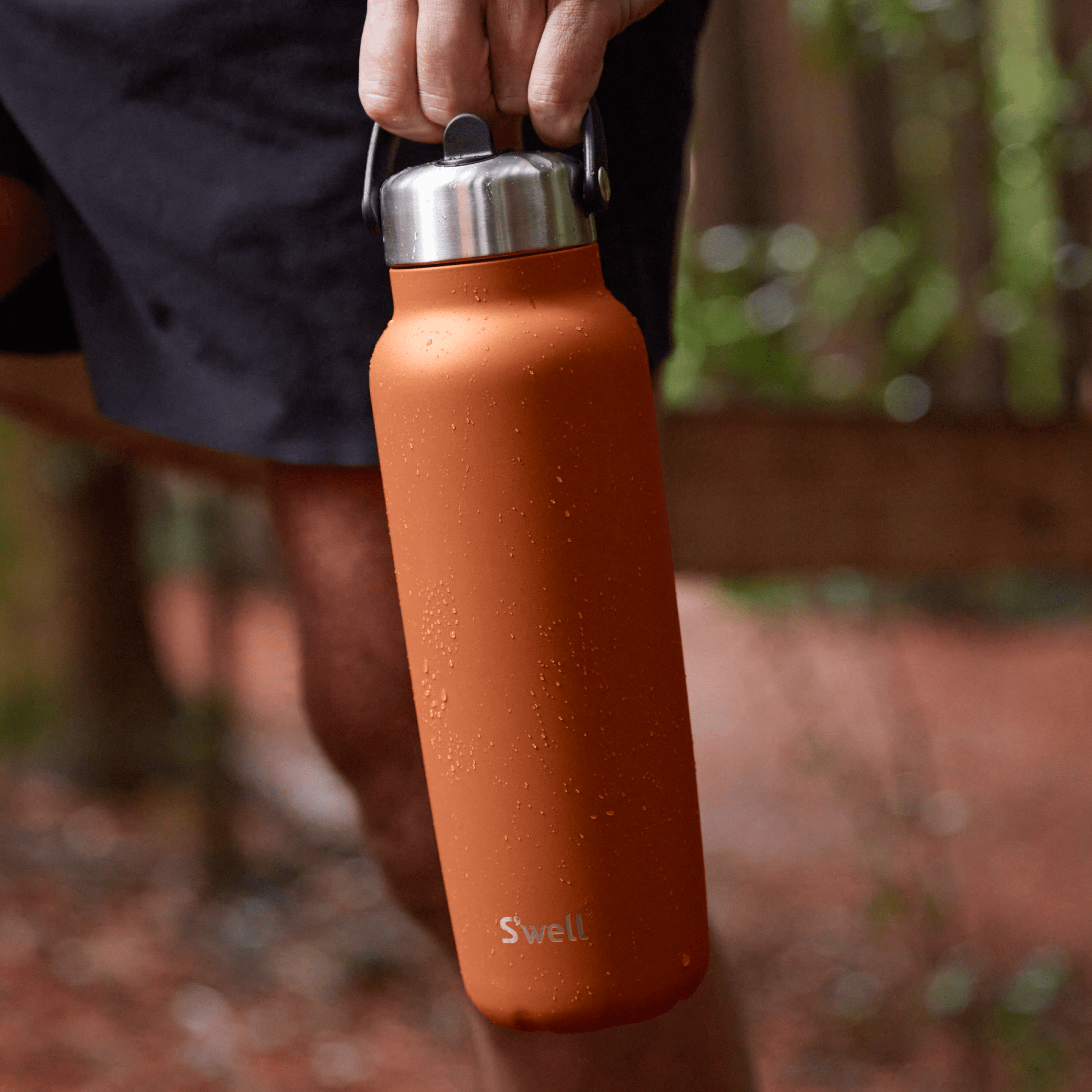 explorer-with-flip-straw-lid-40oz-l8 Swell-Explorer-Water-Bottle-40oz-Orange-Carnelian-LifeStyle.png