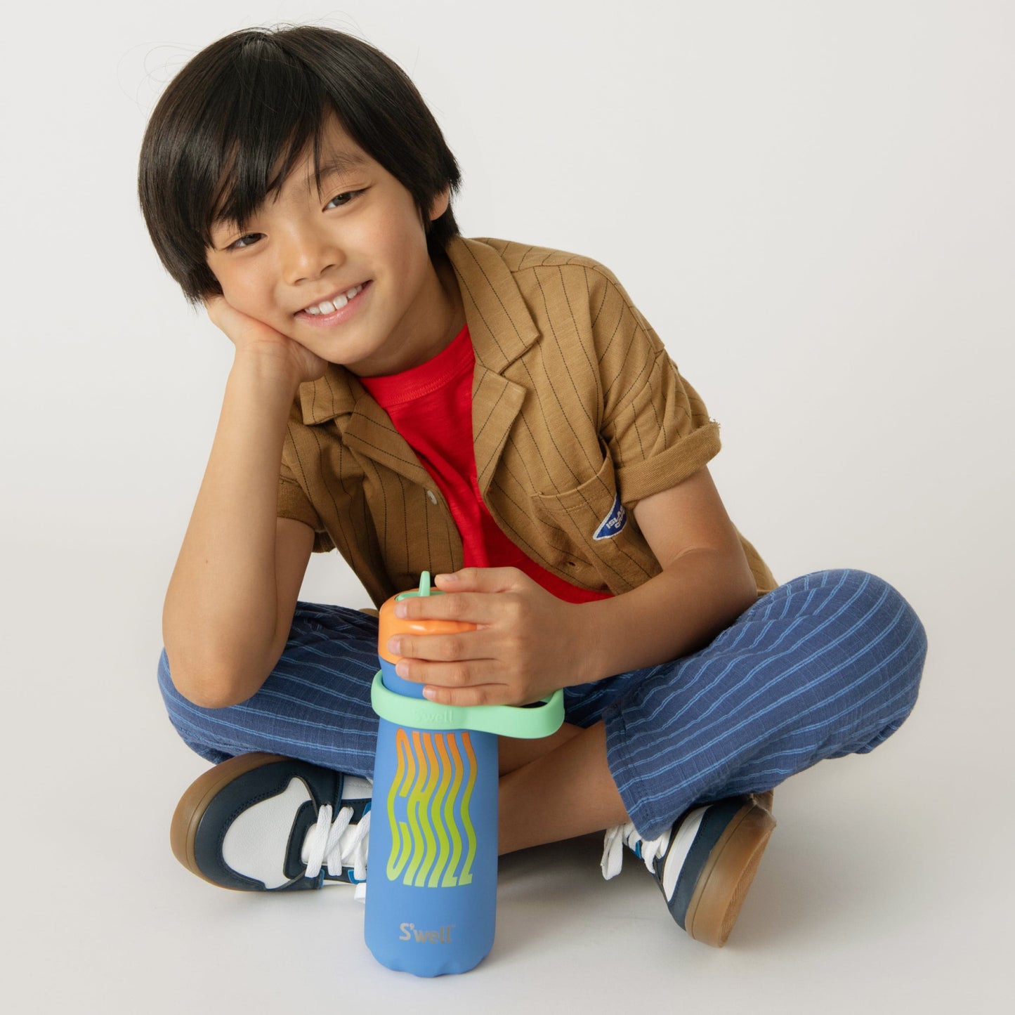 traveler-with-flip-straw-lid-16oz-k5 Swell-Kids-Water-Bottle-Traveler-16oz-Blue-Chill-Lifestyle.jpg